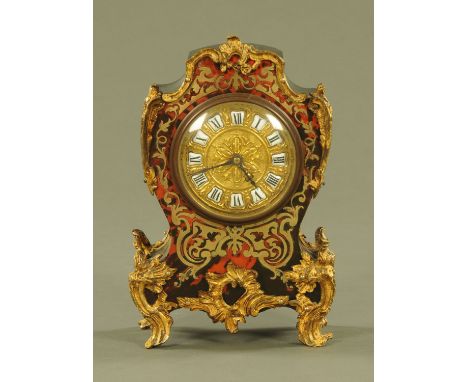 A 19th century French faux tortoiseshell and brass marquetry mantle clock, with ceramic numerals and single train movement.  