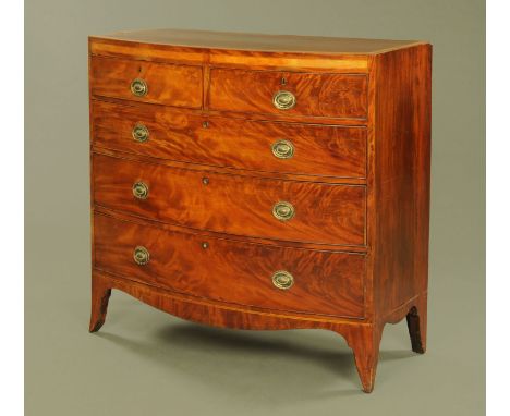 An early 19th century mahogany satinwood banded bow fronted chest of drawers, two short and three long with brass drop handle