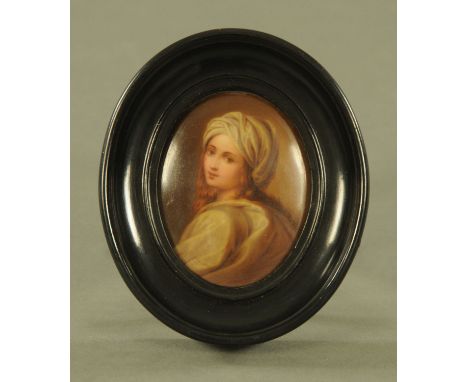 A late 19th century Continental oval porcelain portrait plaque, possibly Berlin in ebonised oval frame.  12.5 cm x 11 cm.