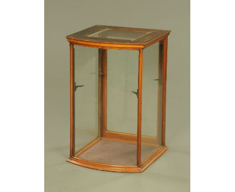 A Victorian mahogany framed shop display cabinet, bowfronted with rear opening door.  Height 74 cm, width 48 cm, depth 51 cm.