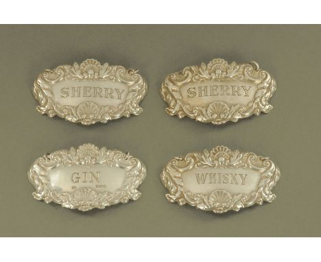 Four silver decanter labels, three Birmingham 1963 maker Cohen and Charles and another similar Birmingham 1964 maker probably