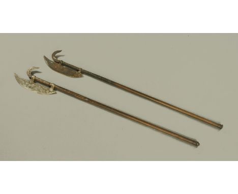 A pair of decorative Halberds, metal bound and with axe head type terminals.  Height 185 cm.