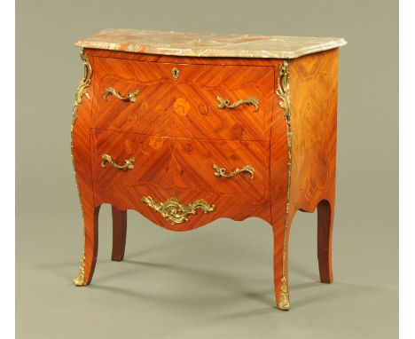 A Continental marble topped two drawer commode cabinet, with brass handles mounts and sabot feet.  Height 85 cm, width 91 cm,