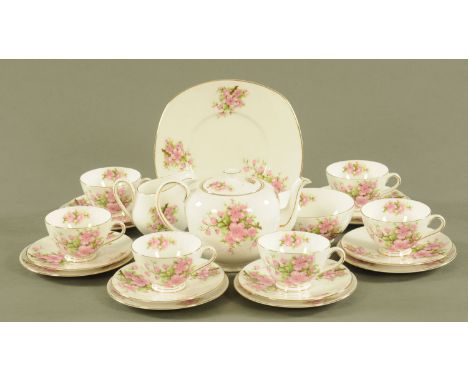 A Tuscan bone china tea set, 6 cups, saucers, plates, 1 large plate, sugar basin, milk jug and teapot.