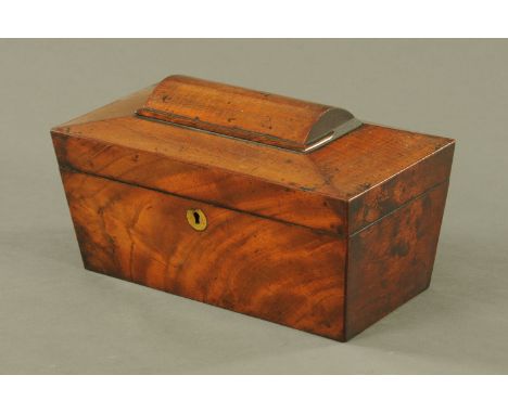 A George III mahogany sarcophagus shaped tea caddy, with two interior divisions and open aperture.  Width 32 cm.