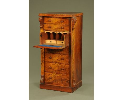 A Victorian walnut secretaire Wellington chest, with caddy top above a series of drawers with wooden knob handles, with carve