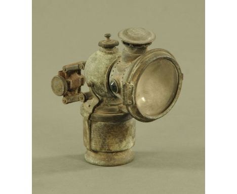 A vintage Lucas King of The Road carbide cycle lamp.