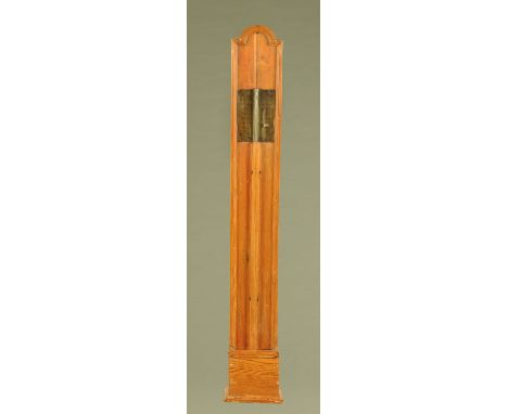 A pine cased stick barometer, with paper label and adjustable scale.  Height 104 cm.