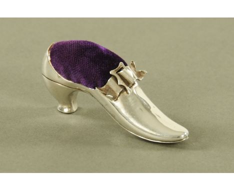 A silver shoe pin cushion, Birmingham 1907 maker Robert Pringle &amp; Sons.  Length 65 mm.