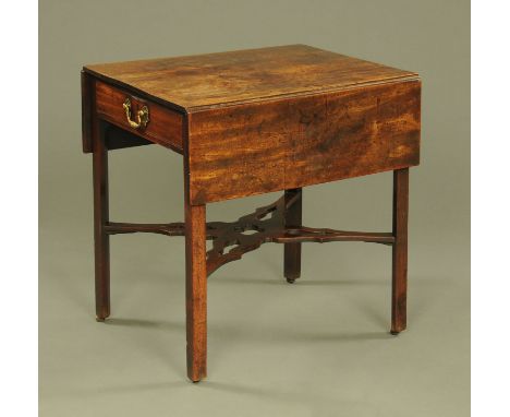 A 19th century mahogany Pembroke table, twin drop flap and raised on chamfered legs of square section terminating in brass ca