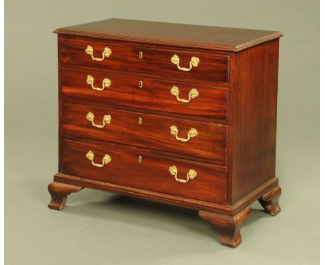 A Georgian mahogany chest of drawers, the top drawer fitted with a slide and secretaire drawer beneath and with three further