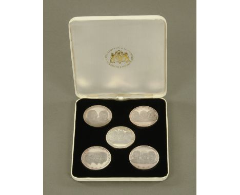 A Slade Hampton &amp; Son Ltd. set of five limited edition medals, honouring the astronauts and in relation to "Mans First La