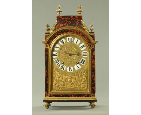 A French boulle work mantle clock, early 19th century with eight day movement chiming on a gong, the dial with enamel Roman n