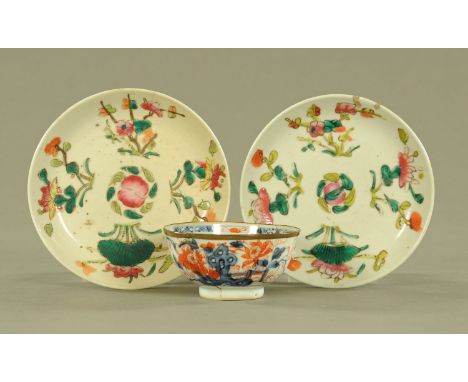 An 18th century Chinese Imari bowl, riveted and with brass bound rim, diameter 11 cm, and two Chinese small plates, each diam