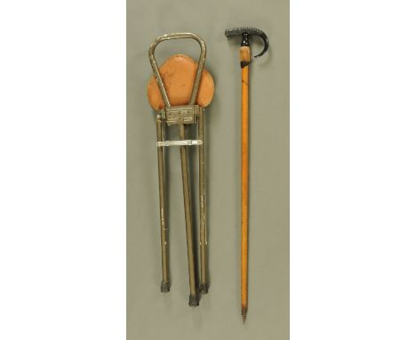 A vintage Interlaken walking stick, with horn and hoof handle, and a shooting stick.
