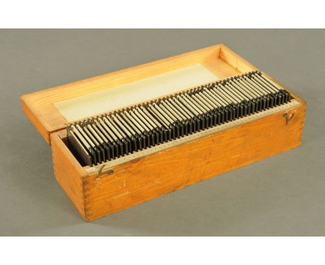 A collection of over 50 late 19th/early century black and white and coloured lantern slides, contained in 2 wooden boxes, sub