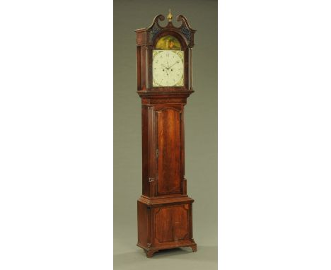 An early 19th century mahogany longcase clock, by Muncaster Whitehaven, with verre eglomise glass panels to the swans neck pe