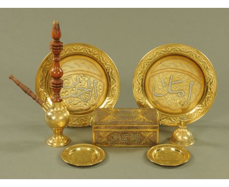 A Cairo ware box, two brass plates and a pipe.