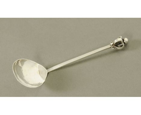 A George V planished silver sauce ladle, arts and crafts design by Albert Edward Jones with Crown terminal, Birmingham 1917, 