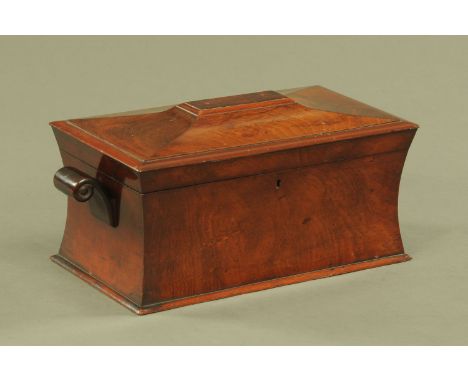 A Regency mahogany sarcophagus shaped tea caddy, with scroll handles and fitted interior.  Width excluding handles 36.5 cm.