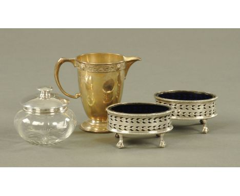 A silver cream jug by Mappin &amp; Webb, London 1946, a silver mounted dressing table jar, Birmingham 1925 and a pair of Adam