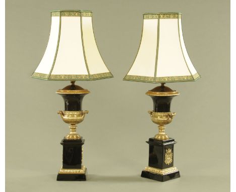 A pair of Regency style lamp bases, each in the form of a classical urn and with stepped base with metal mounts.  Height 56 c