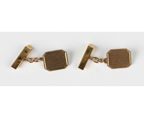 A pair of 9ct gold cufflinks, the cut cornered rectangular fronts with engine turned decoration, with elongated rectangular b