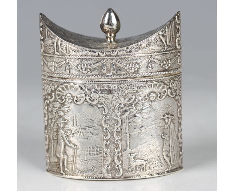 A late 19th century Dutch silver tea caddy of elliptical form with everted dome hinged lid and tapered finial, above relief d