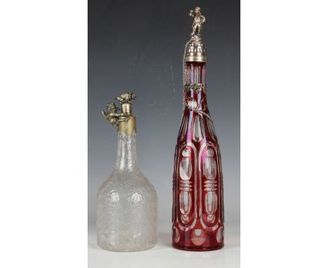 A Bohemian ruby flash overlay and clear cut glass decanter, fitted with a Russian silver cover, 84 zolotnik, the finial model