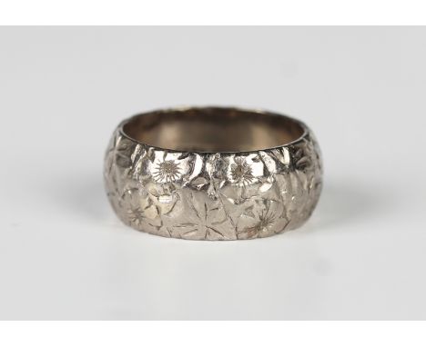 An 18ct white gold wedding ring with floral decoration, London 1961, weight 9.5g, ring size approx L1/2.Buyer’s Premium 29.4%