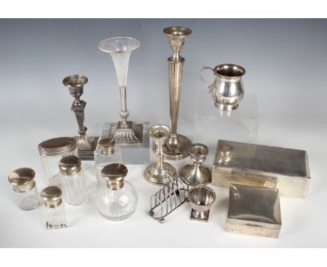 A George V silver baluster candlestick on a circular base, Birmingham 1925, height 10.3cm, a silver stub candlestick, Birming