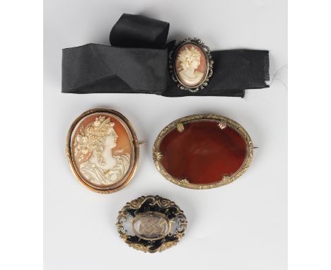 A Victorian gold mounted oval shell cameo brooch, carved as a portrait of a lady,  unmarked, weight 15.1g, width 4.5cm, a sma
