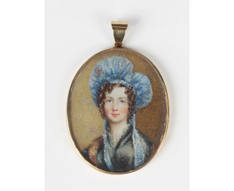 A gold mounted oval pendant locket frame, one side glazed with a painted portrait miniature of a lady wearing a blue bonnet, 