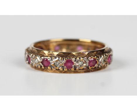 A 9ct gold, ruby and diamond full eternity ring, mounted with circular cut rubies alternating with smaller circular cut diamo