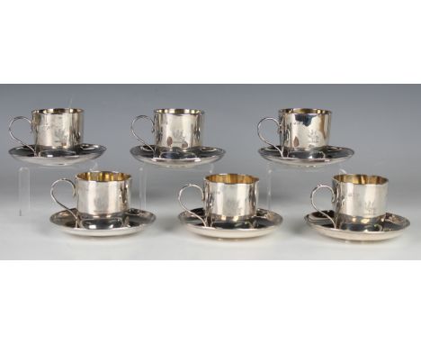 A set of six late Victorian silver cups, each cylindrical body engraved with opposing crest, together with four matching sauc