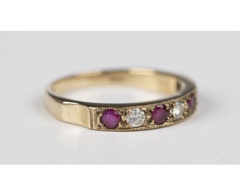 A 9ct gold, ruby and diamond seven stone half-hoop ring, mounted with four circular cut rubies alternating with three circula