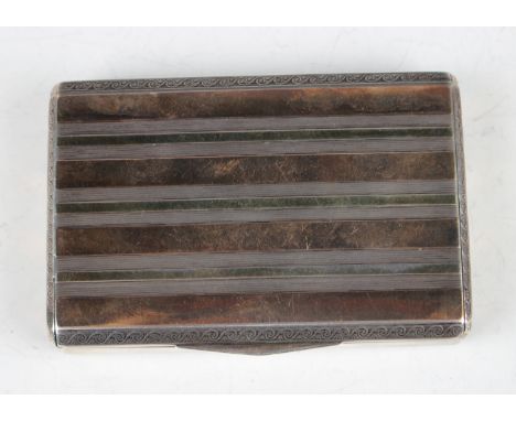 A .900 silver rectangular snuff box with banded engine turned decoration within scroll borders, the interior presentation ins