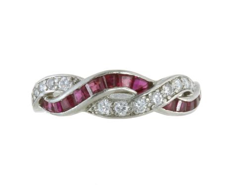 A RUBY AND DIAMOND DRESS RING, OSCAR HEYMAN in platinum, designed as a bifurcated and interwoven band, half set with round cu