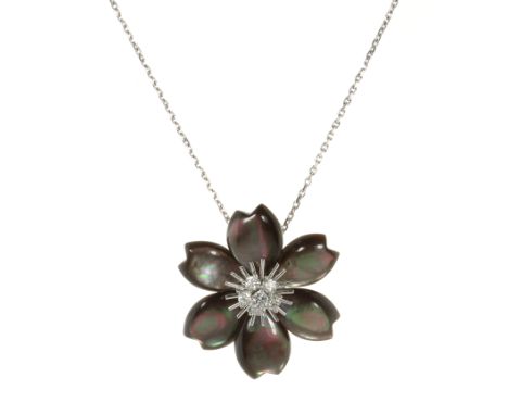 A MOTHER OF PEARL AND DIAMOND ROSE DE NOEL BROOCH / PENDANT, VAN CLEEF &amp; ARPELS in 18ct white gold, designed as a winter 