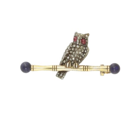 A DIAMOND, RUBY AND LAPIS LAZULI OWL BROOCH in yellow gold and silver, designed as an owl, its body jewelled with diamonds, i