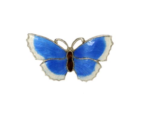 AN ANTIQUE ENAMEL BUTTERFLY BROOCH in sterling silver, designed as a butterfly, its body and wings jewelled with blue, brown 