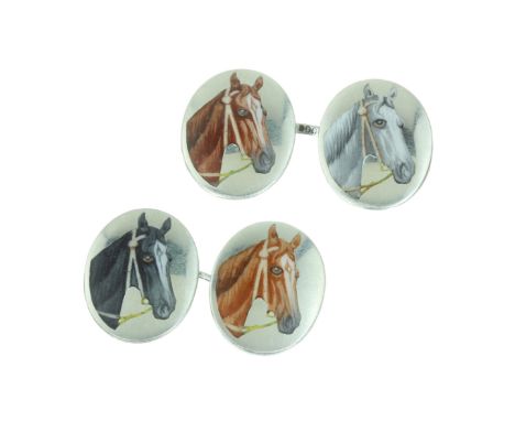 A PAIR OF ANTIQUE ENAMEL HORSE CUFFLINKS in silver, each formed of two oval faces decorated in enamel with a depiction of a h