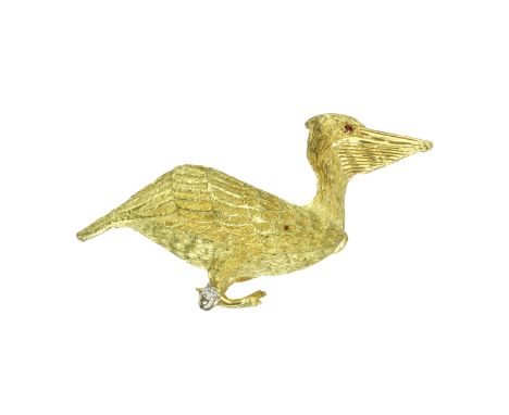 A RUBY AND DIAMOND PELICAN BROOCH, MAURICE GUYOT in 18ct yellow gold, in the form of a pelican, cast in detail with ruby eyes