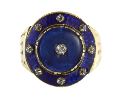 AN ANTIQUE ENAMEL AND DIAMOND DRESS RING in high carat yellow gold, the large blue enamel faced set with a cluster of nine ro