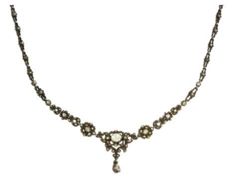 AN ANTIQUE DIAMOND NECKLACE, DUTCH set with a central rose cut diamond of 7.3mm within a scrolling, diamond set surround, sus