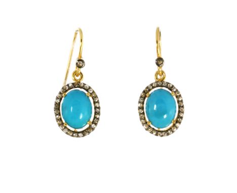 A PAIR OF TURQUOISE AND DIAMOND CLUSTER EARRINGS in gold and silver, each set with a central oval cabochon turquoise encircle