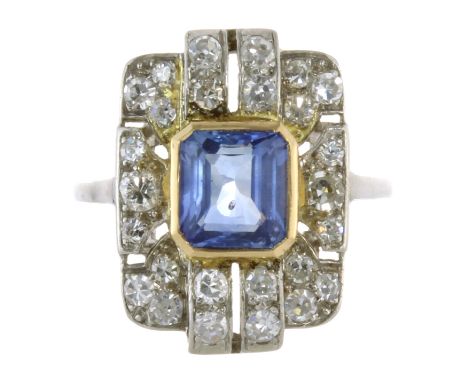 AN ANTIQUE ART DECO BLUE SAPPHIRE AND DIAMOND RING in platinum, set with a central step cut blue sapphire of 1.58 carats with