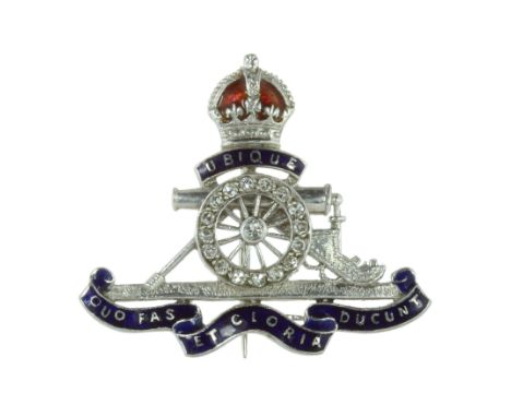 AN ANTIQUE REGIMENTAL ROYAL ARTILLERY DIAMOND AND ENAMEL BROOCH / CAP BADGE in 18ct white gold and platinum designed as the R