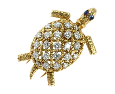 A DIAMOND AND SAPPHIRE TURTLE BROOCH, CARTIER in 18ct yellow gold modelled as a turtle, its shell jewelled with round cut dia