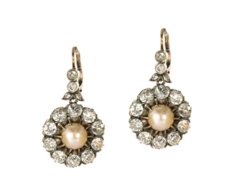 A PAIR OF ANTIQUE PEARL AND DIAMOND EARRINGS CIRCA 1890 in high carat yellow gold and silver, each set with a central pearl o